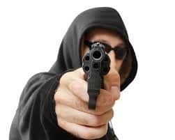 Man holding a gun, robbing a bank